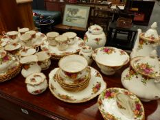 A QTY OF ROYAL ALBERT OLD COUNTRY ROSE TEA AND DINNERWARES.