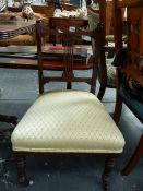 AN EDWARDIAN INLAID NURSING CHAIR.