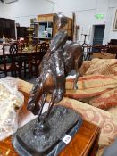 A BRONZE BUCKING BRONCO.