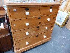 A LARGE VICTORIAN PINE CHEST OF DRAWERS.