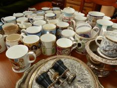 A LARGE QTY OF COMMEMORATIVE CUPS.