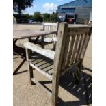 A PAIR OF TEAK GARDEN ARMCHAIRS.