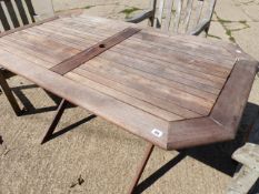 A TEAK PATIO TABLE.