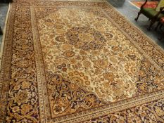 A LARGE PERSIAN PATTERN CARPET.