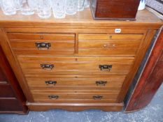 A SATINWOOD CHEST OF DRAWERS.