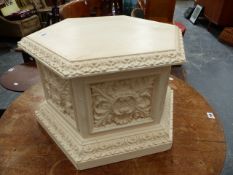 A CARVED AND PAINTED DISPLAY STAND.