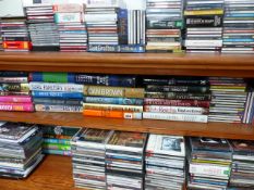 A QTY OF BOOKS AND CDS.