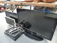 A SAMSUNG FLATSCREEN TV AND TWO OTHER SMALLER, DVD PLAYER,ETC.