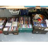 A LARGE QTY OF DVDS AND CDS.