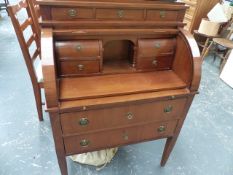 A WALNUT CYLINDER TOP BUREAU.