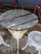 A PUB TABLE WITH PAINTED CAST IRON BASE.