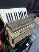 A SMALL PIANO ACCORDIAN.