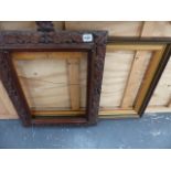 A CARVED OAK PICTURE FRAME AND ONE OTHER.