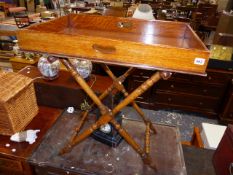 A VICTORIAN OAK BUTLER'S TRAY ON STAND.