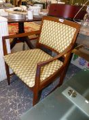 A MID CENTURY TEAK ARMCHAIR.