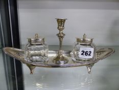 A HALLMARKED SILVER INKSTAND WITH CENTRAL TAPER STICK.