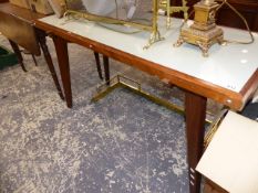 A MID CENTURY TEAK FRAME TABLE.