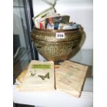 A LARGE EASTERN BRASS BOWL AND A COLLECTION OF CIGARETTE AND TEA CARDS.