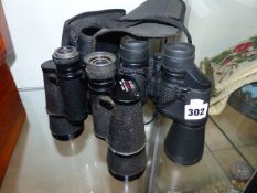 TWO PAIRS OF BINOCULARS.