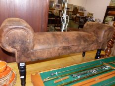 A LEATHER UPHOLSTERED SCROLL END STOOL.