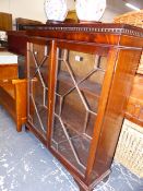 A MAHOGANY GLAZED BOOKCASE.