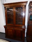 A VICTORIAN MAHOGANY GLAZED BOOKCASE.