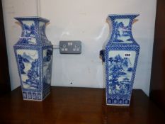 A PAIR OF BLUE AND WHITE VASES.