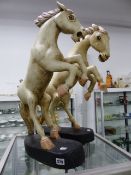 A PAIR OF HORSE FIGURES.