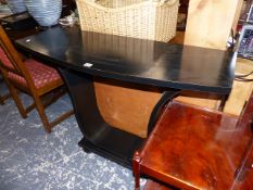 AN EBONISED CONSOLE TABLE.