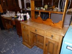 A PINE KNEEHOLE DESK AND A WALL SHELF TOGETHER WITH A SIDEBOARD.