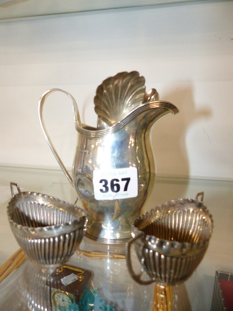 A 19th.C.HALLMARKED SILVER CREAM JUG, VARIOUS SPOONS AND A PAIR OF SILVER SALTS.