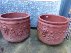A PAIR OF TERRACOTTA PLANTERS.