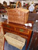 A PICNIC HAMPER AND A LAUNDRY BASKET.