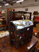 AN ORIENTAL TIERED STORAGE BOX.