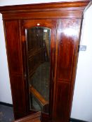 AN EDWARDIAN INLAID WARDROBE.