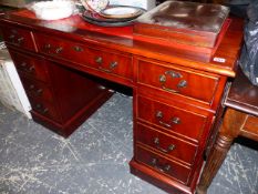 A REPRODUCTION MAHOGANY PEDESTAL DESK.