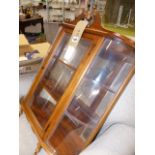 A SMALL GLAZED WALL DISPLAY CABINET.