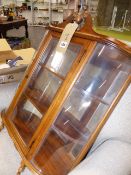 A SMALL GLAZED WALL DISPLAY CABINET.