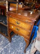 A WALNUT BEDSIDE CHEST.