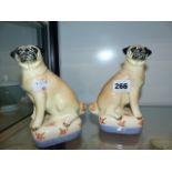 A PAIR OF PUG DOG FIGURES BY MIRANDA SMITH.