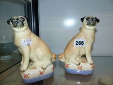 A PAIR OF PUG DOG FIGURES BY MIRANDA SMITH.