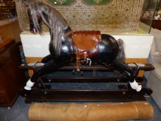 A LARGE ROCKING HORSE.