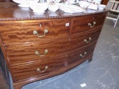 AN ANTIQUE MAHOGANY BOW FRONT CHEST OF DRAWERS.