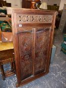 AN ANTIQUE EASTERN TWO DOOR PANEL.