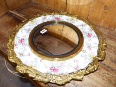 A POTTERY FRAMED WALL MIRROR.