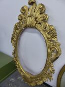 AN ELABORATE GILT MIRROR FRAME.