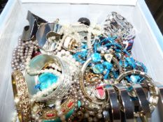 A BOX OF COSTUME JEWELLERY.