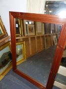 A PINE FRAMED MIRROR.