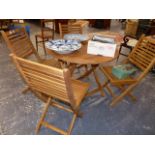 A GOOD QUALITY TEAK PATIO TABLE AND FOUR CHAIRS.