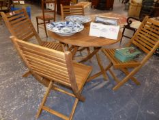 A GOOD QUALITY TEAK PATIO TABLE AND FOUR CHAIRS.